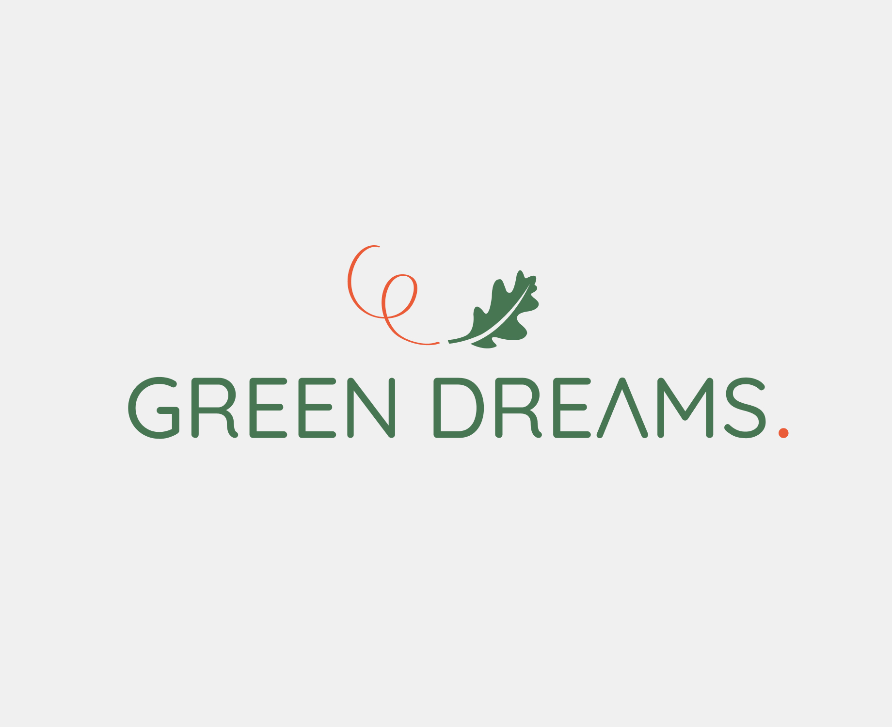 Logo Green dreams avec une feuille de chêne verte qui virevolte et dont le mouvement est visible par un filet rouge.